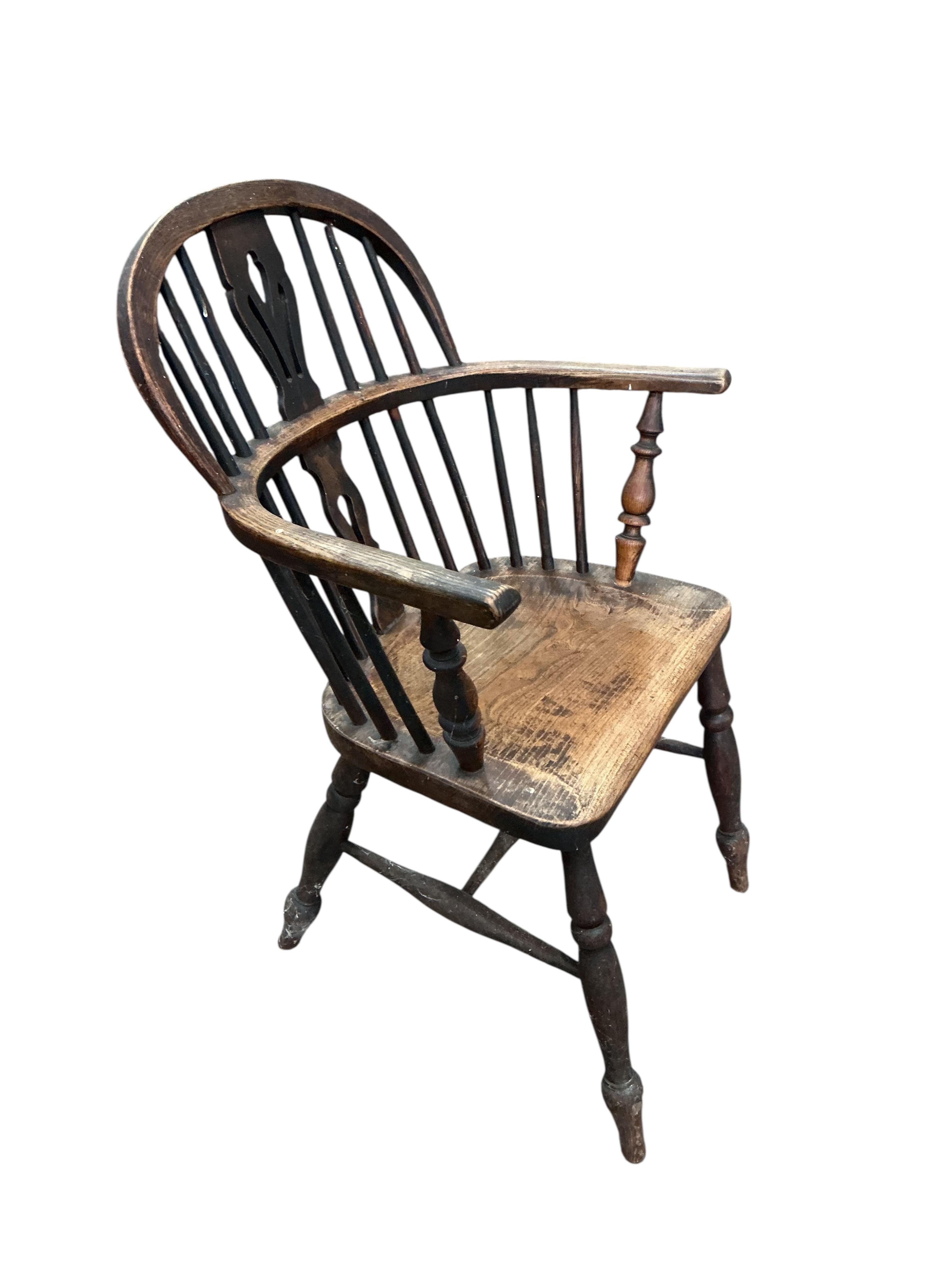A mid 19th century ash and elm Windsor elbow chair, width 56cm, depth 37cm, height 91cm
